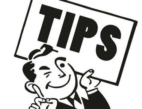 a cartoon man in a suit winking while holding a sign that says "tips"