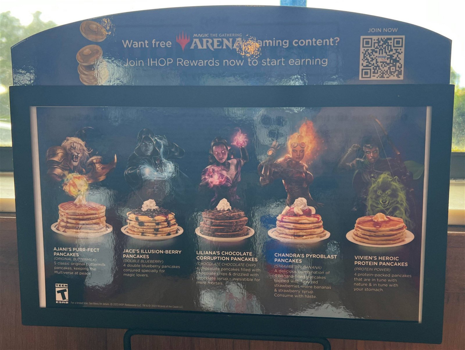 an ihop table display with multiple mtg planeswalkers